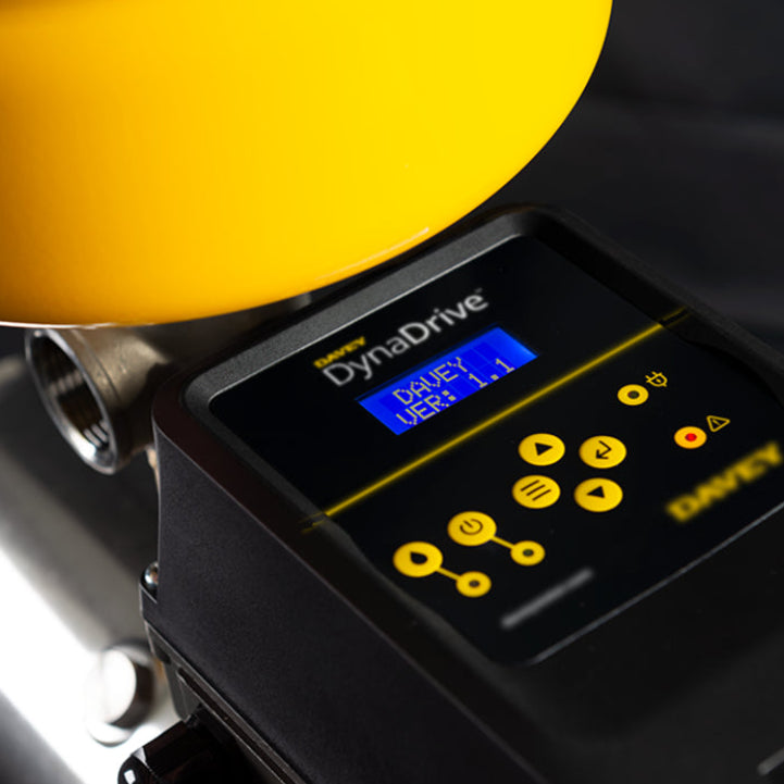 Close-up of a DynaDrive power tool with digital display on a dark background